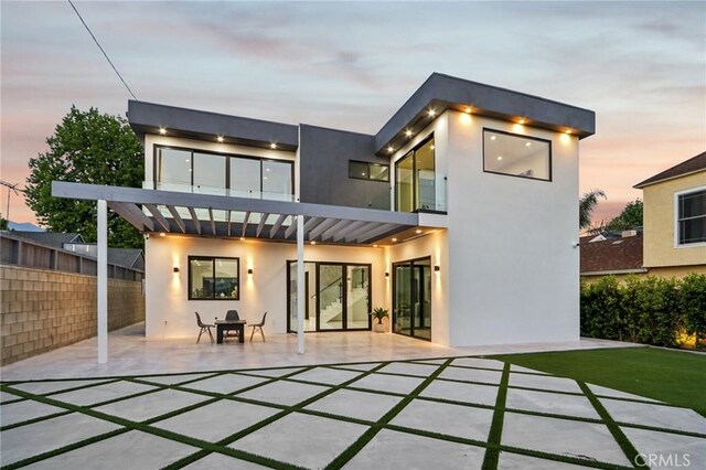 2227 N Lamer St, Burbank, CA 91504 - back of house at dusk with a patio area and stucco siding