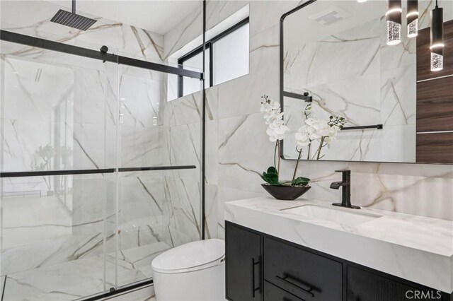 2227 N Lamer St, Burbank, CA 91504 - bathroom featuring tile walls, vanity, and a marble finish shower
