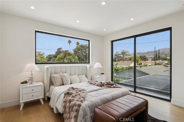 2227 N Lamer St, Burbank, CA 91504 - bedroom with access to outside, recessed lighting, wood finished floors, and baseboards