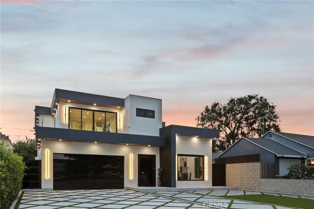 2227 N Lamer St, Burbank, CA 91504 - contemporary house with driveway, stucco siding, a balcony, and a garage