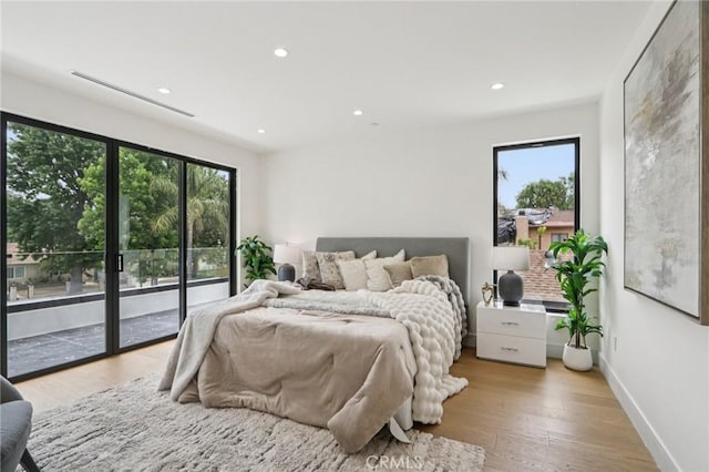 2227 N Lamer St, Burbank, CA 91504 - bedroom featuring multiple windows, access to outside, recessed lighting, light wood finished floors, and baseboards