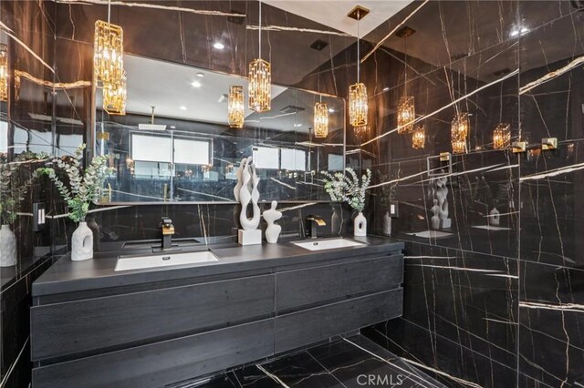 2227 N Lamer St, Burbank, CA 91504 - full bath featuring double vanity, marble tiled flooring, and tile walls