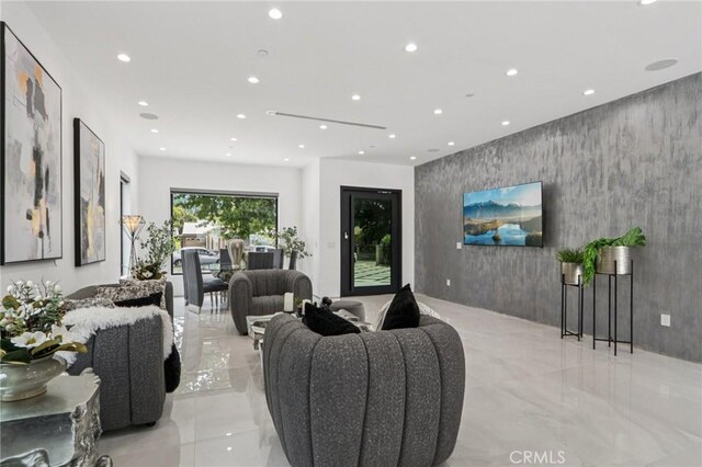 2227 N Lamer St, Burbank, CA 91504 - living room with light marble finish flooring, recessed lighting, and an accent wall