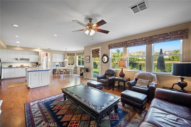 3262 Bluebird Cir, Simi Valley, CA 93063 - living area with ceiling fan, wood finished floors, and recessed lighting