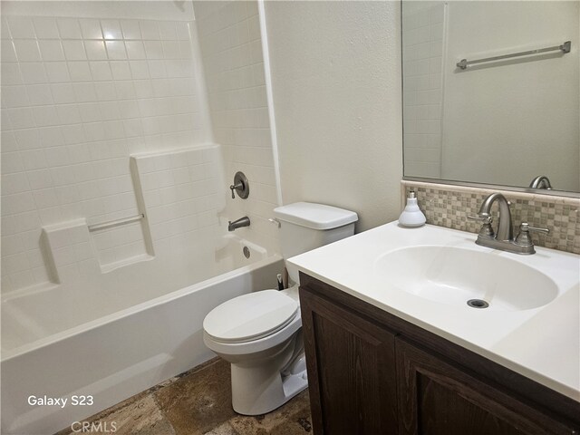 345 W Saint Andrews St, Ontario, CA 91762 - bathroom with vanity, bathtub / shower combination, stone finish flooring, and tasteful backsplash