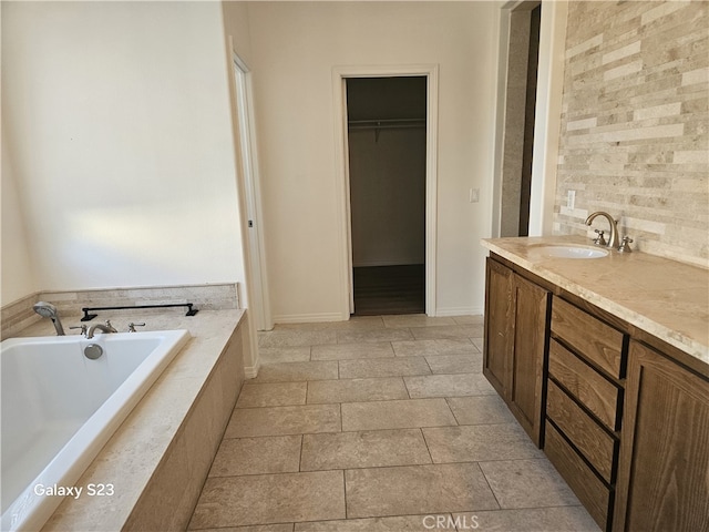 345 W Saint Andrews St, Ontario, CA 91762 - full bathroom featuring a garden tub, vanity, and a spacious closet