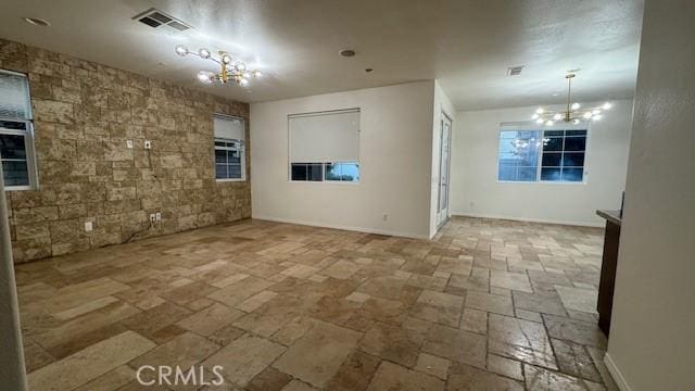 345 W Saint Andrews St, Ontario, CA 91762 - unfurnished room featuring a chandelier and stone tile flooring