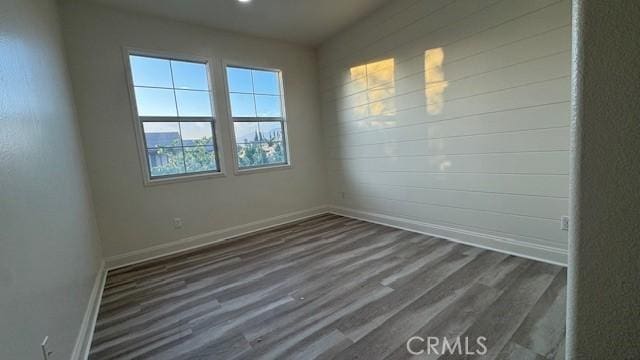 345 W Saint Andrews St, Ontario, CA 91762 - unfurnished room featuring baseboards and dark wood finished floors