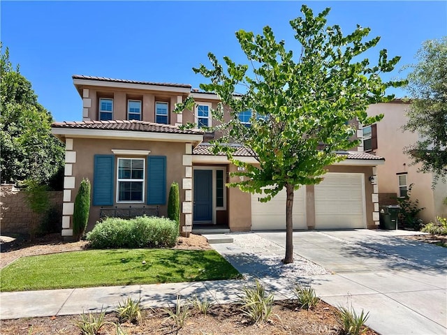 345 W Saint Andrews St, Ontario, CA 91762 - mediterranean / spanish home featuring a tile roof, stucco siding, concrete driveway, and an attached garage