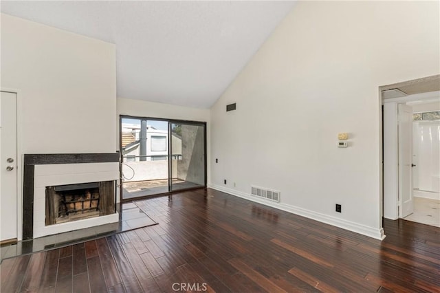 13115 Le Parc Unit 40, Chino Hills, CA 91709 - unfurnished living room with high vaulted ceiling, hardwood / wood-style floors, a fireplace, and baseboards