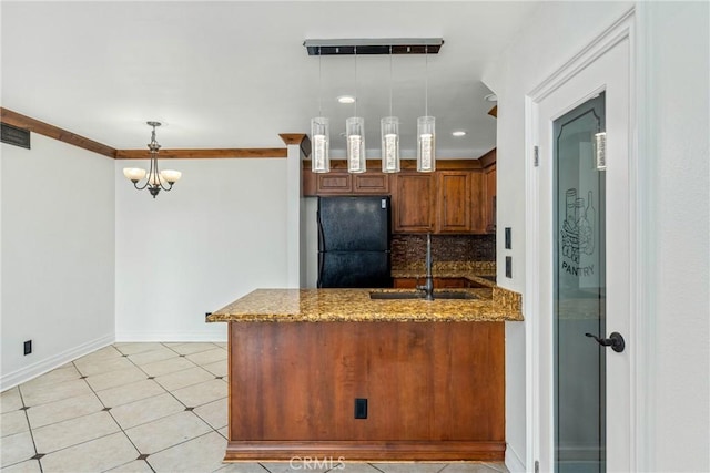 13115 Le Parc Unit 40, Chino Hills, CA 91709 - kitchen featuring freestanding refrigerator, a sink, a peninsula, tasteful backsplash, and dark stone countertops