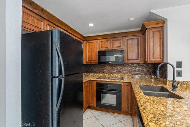 13115 Le Parc Unit 40, Chino Hills, CA 91709 - kitchen with black appliances, a sink, light tile patterned flooring, brown cabinetry, and backsplash
