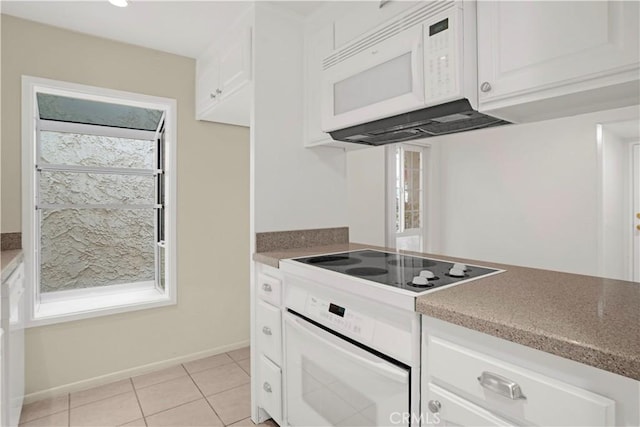 18411 Hatteras St Unit 122, Tarzana, CA 91356 - kitchen featuring white appliances, white cabinets, light tile patterned flooring, and stone countertops