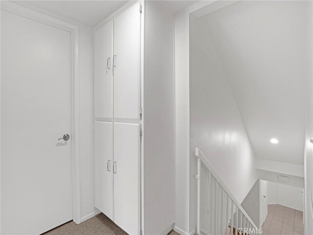 18411 Hatteras St Unit 122, Tarzana, CA 91356 - hallway with an upstairs landing, baseboards, and recessed lighting
