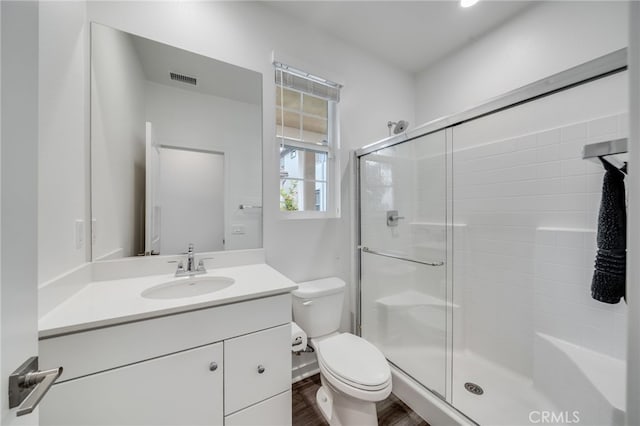 7452 Desert Holly St, Chino, CA 91708 - full bath featuring a shower stall, toilet, vanity, and wood finished floors