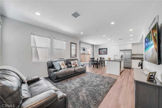 7452 Desert Holly St, Chino, CA 91708 - living room with recessed lighting and light wood-style flooring