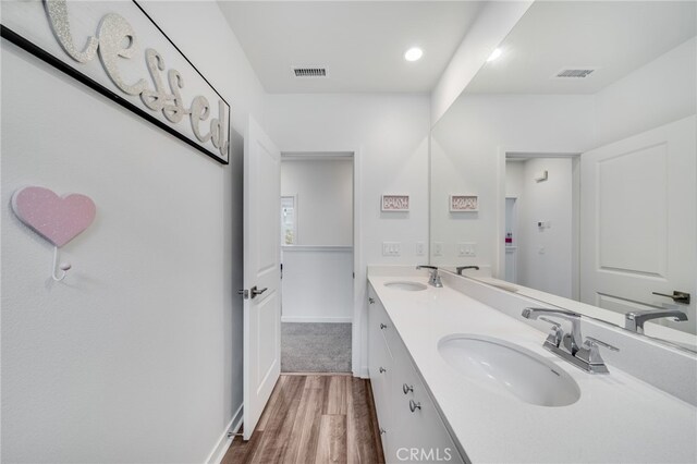 7452 Desert Holly St, Chino, CA 91708 - bathroom with wood finished floors and double vanity