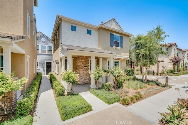 7452 Desert Holly St, Chino, CA 91708 - multi unit property featuring a porch, brick siding, and stucco siding