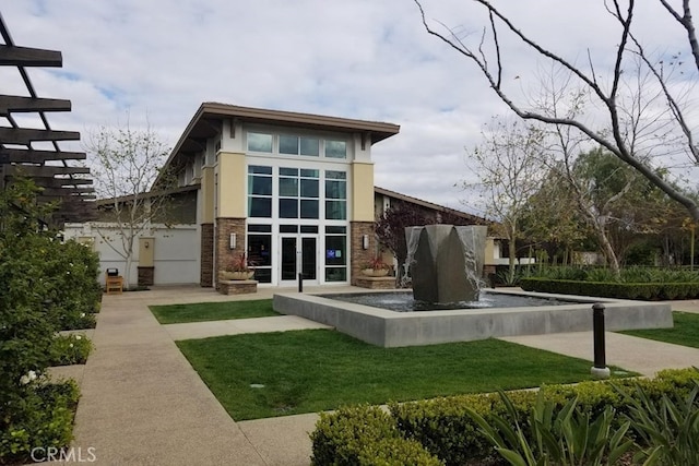 6045 Lyon St, Chino, CA 91710 - back of house featuring stucco siding, french doors, and stone siding