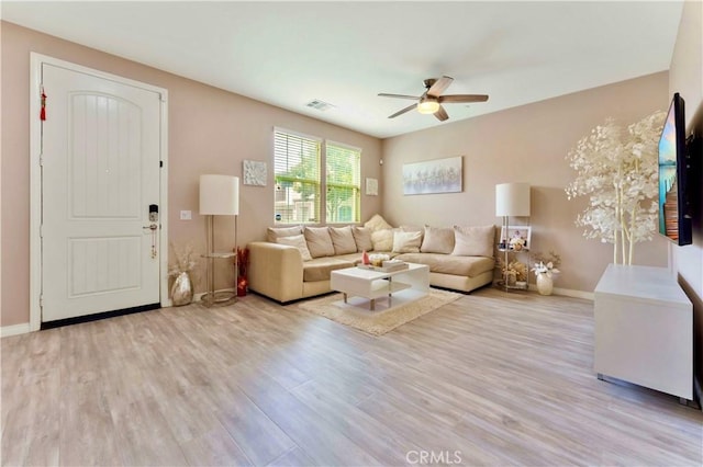 6045 Lyon St, Chino, CA 91710 - living area featuring a ceiling fan and wood finished floors