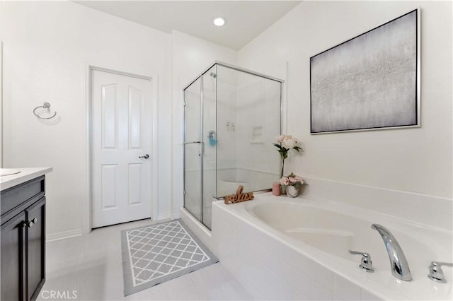 6045 Lyon St, Chino, CA 91710 - full bathroom with a stall shower, a garden tub, and vanity