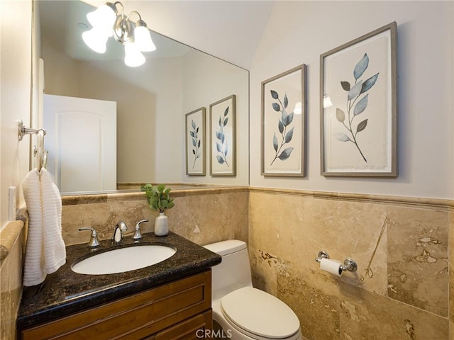 229 N Juanita Ave Unit B, Redondo Beach, CA 90277 - bathroom featuring tile walls, vanity, toilet, and a wainscoted wall