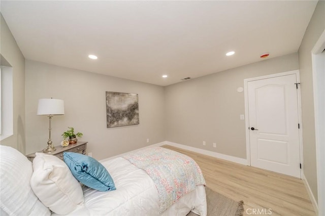 6367 Willow Ave, Rialto, CA 92377 - bedroom with wood finished floors and recessed lighting