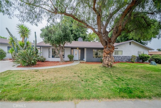 6367 Willow Ave, Rialto, CA 92377 - single story home featuring stucco siding, a front lawn, and a chimney