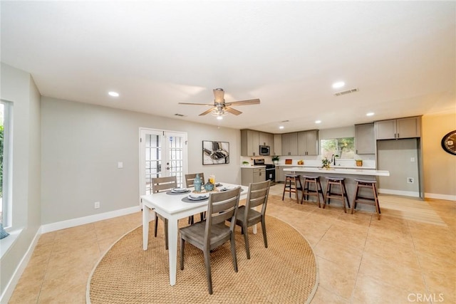 6367 Willow Ave, Rialto, CA 92377 - dining space featuring light tile patterned floors, plenty of natural light, recessed lighting, and french doors