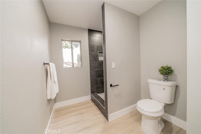 6367 Willow Ave, Rialto, CA 92377 - bathroom with wood finished floors and a tile shower