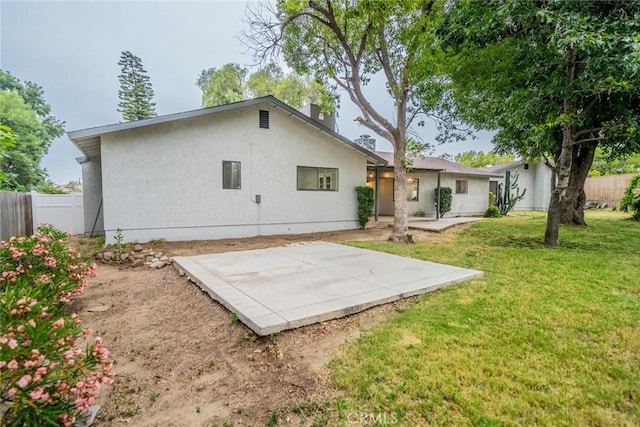 6367 Willow Ave, Rialto, CA 92377 - rear view of property featuring a patio, stucco siding, and a chimney