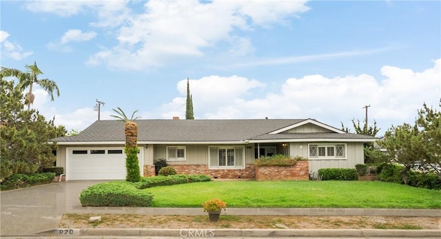 920 Wildrose, Brea, CA 92821 - ranch-style house featuring concrete driveway, a garage, a front yard, board and batten siding, and brick siding