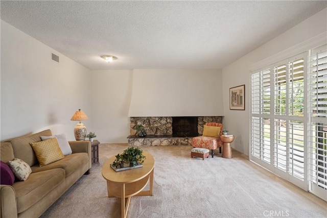 920 Wildrose, Brea, CA 92821 - living room with carpet, a fireplace, and a textured ceiling