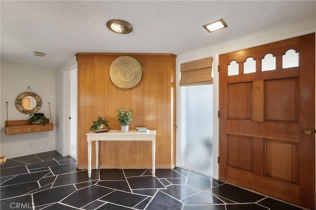 920 Wildrose, Brea, CA 92821 - foyer featuring a textured ceiling and wood walls