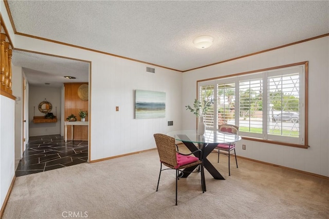 920 Wildrose, Brea, CA 92821 - carpeted dining area featuring crown molding, a textured ceiling, and wood walls