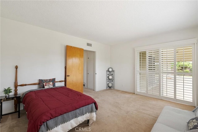 920 Wildrose, Brea, CA 92821 - carpeted bedroom with access to exterior and a textured ceiling