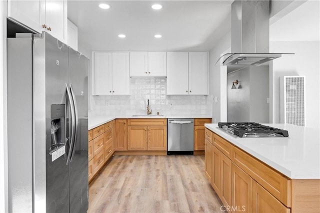 12119 Los Coyotes Ave, La Mirada, CA 90638 - kitchen featuring appliances with stainless steel finishes, island range hood, a sink, light countertops, and recessed lighting