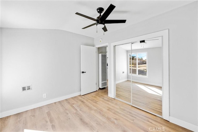 12119 Los Coyotes Ave, La Mirada, CA 90638 - unfurnished bedroom featuring a heating unit, wood finished floors, vaulted ceiling, a closet, and a ceiling fan