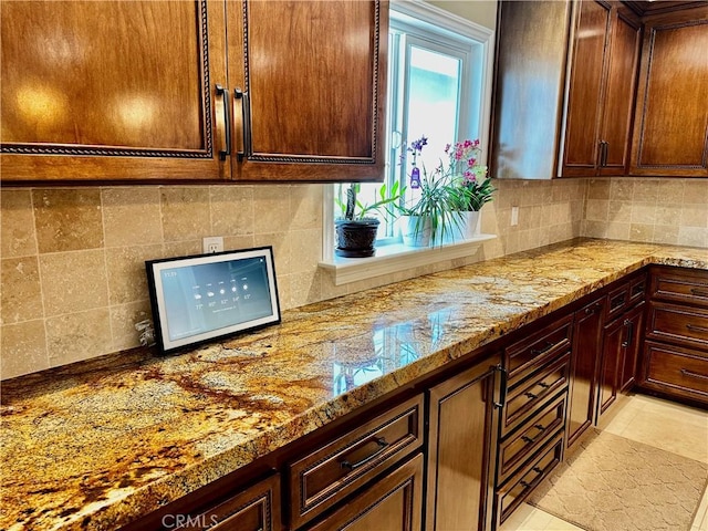 7562 Dartmouth Ave, Rancho Cucamonga, CA 91730 - kitchen featuring backsplash and light stone countertops