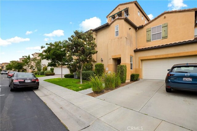 367 Caminito Barcelona, Chula Vista, CA 91914 - view of front of house featuring driveway, stucco siding, an attached garage, and a tiled roof
