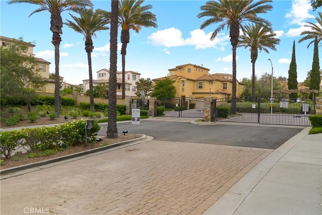 367 Caminito Barcelona, Chula Vista, CA 91914 - view of asphalt street featuring a residential view, a gate, a gated entry, and curbs