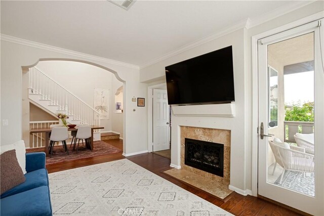 367 Caminito Barcelona, Chula Vista, CA 91914 - living room with ornamental molding, stairs, wood finished floors, arched walkways, and a premium fireplace
