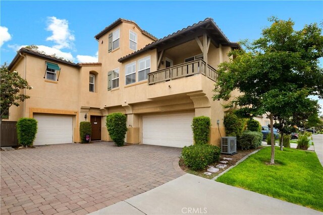 367 Caminito Barcelona, Chula Vista, CA 91914 - view of front of home featuring a balcony, a garage, stucco siding, decorative driveway, and a front lawn