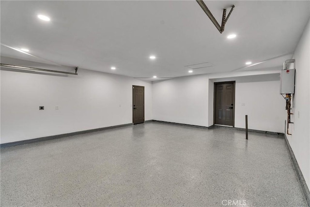 16409 Barbee St, Fontana, CA 92336 - garage featuring recessed lighting and baseboards