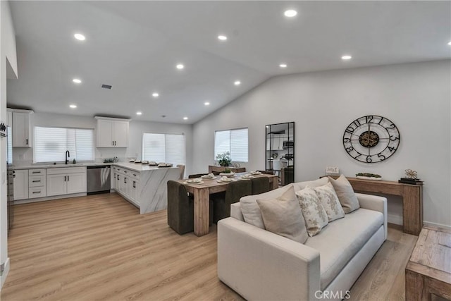 16409 Barbee St, Fontana, CA 92336 - living area with vaulted ceiling, light wood finished floors, and recessed lighting
