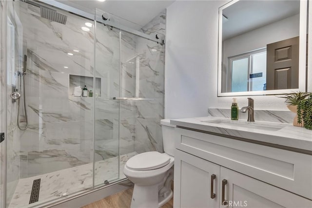 16409 Barbee St, Fontana, CA 92336 - bathroom with vanity, a marble finish shower, and wood finished floors