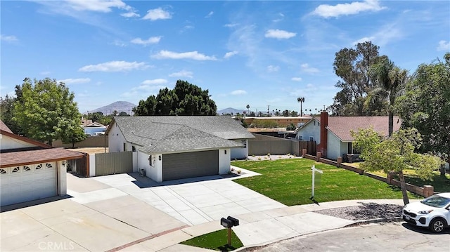 16409 Barbee St, Fontana, CA 92336 - view of front of house featuring driveway, a garage, a mountain view, stucco siding, and a shingled roof