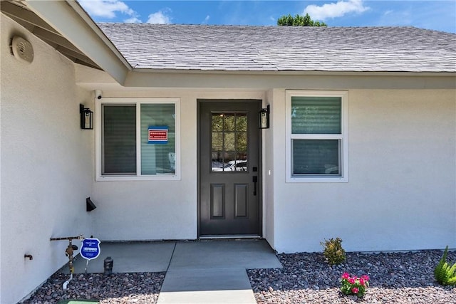 16409 Barbee St, Fontana, CA 92336 - entrance to property featuring roof with shingles and stucco siding