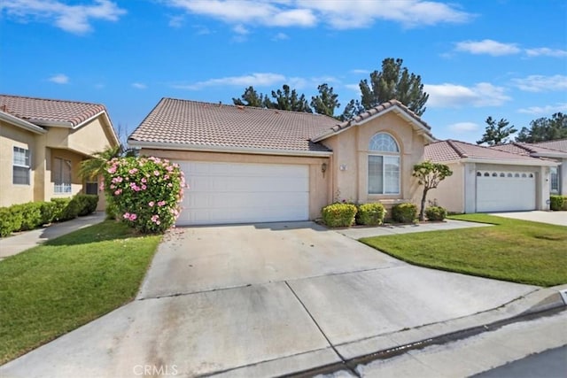 797 Camino De Plata, San Jacinto, CA 92583 - view of front of home featuring an attached garage, a front yard, driveway, and a tile roof