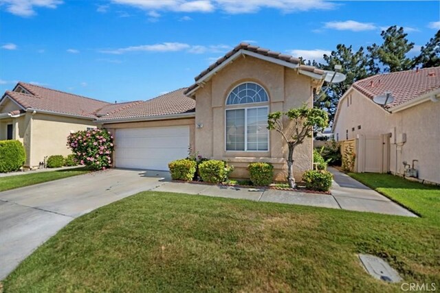 797 Camino De Plata, San Jacinto, CA 92583 - mediterranean / spanish-style home with a tiled roof, driveway, stucco siding, and an attached garage